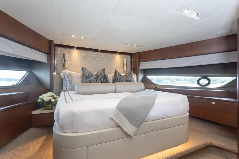Slide: The Image of Luxurious bedroom interior of 2019 Princess Y88 Motor Yacht with elegant decor and large windows. - 20