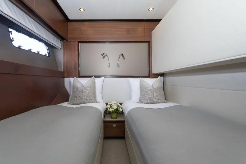 Slide: The Image of Luxurious twin bedroom in 2019 Princess Y88 Motor Yacht with elegant decor and soft lighting. - 25