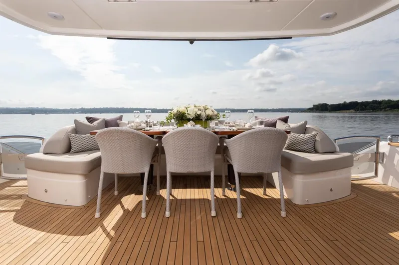 Slide: The Image of Luxurious dining area on 2019 Princess Y88 Motor Yacht with scenic water view. - 26