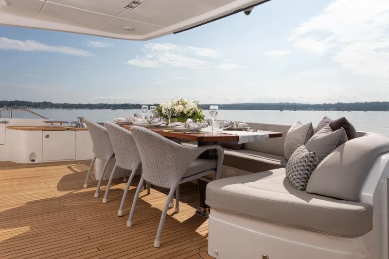 Slide: The Image of Luxurious dining area on 2019 Princess Y88 Motor Yacht with elegant table setting. - 27