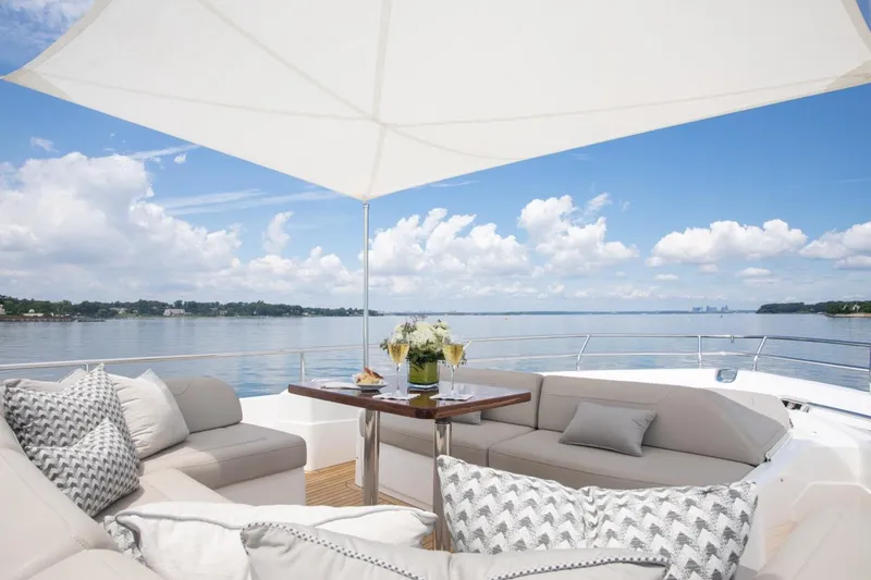 Slide: The Image of Luxurious 2019 Princess Y88 Motor Yacht deck with elegant seating and ocean view. - 33