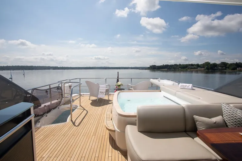 Slide: The Image of Luxurious 2019 Princess Y88 Motor Yacht deck with hot tub and scenic water view. - 35