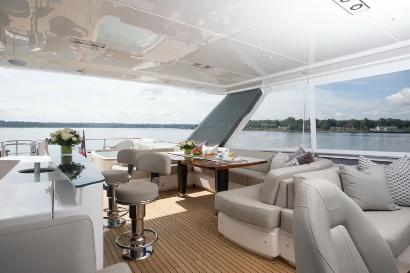 Slide: The Image of Luxurious 2019 Princess Y88 Motor Yacht interior with elegant seating and scenic water views. - 37