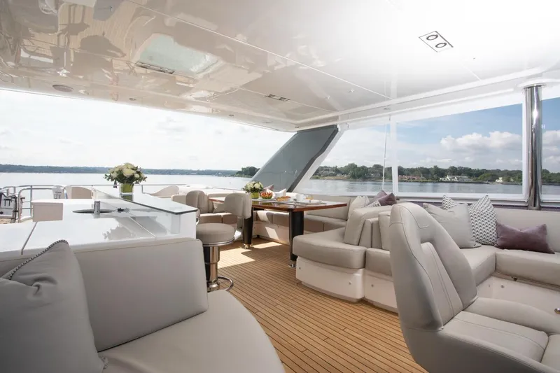 Slide: The Image of Luxurious 2019 Princess Y88 Motor Yacht interior with elegant seating and scenic water views. - 38