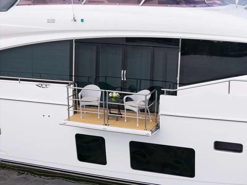 Slide: The Image of 2019 Princess Y88 Motor Yacht with elegant balcony seating and glass doors. - 44
