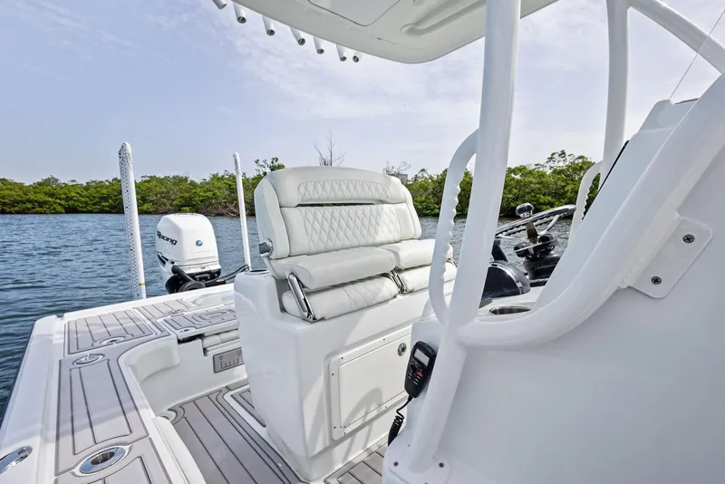 Slide: The Image of 2018 Barker Boatworks 26 Calibogue Bay interior with seating and water view. - 30
