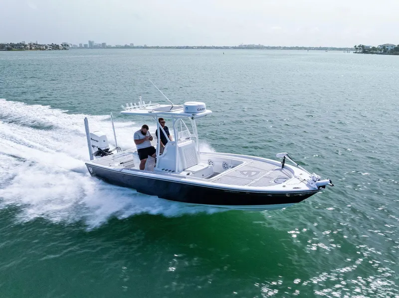 Slide: The Image of 2018 Barker Boatworks 26 Calibogue Bay cruising on open water. - 40