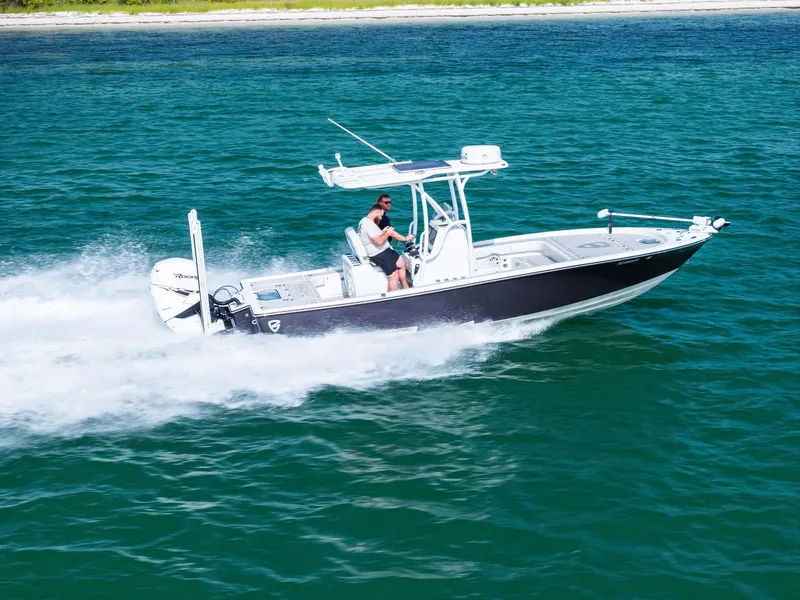 Slide: The Image of 2018 Barker Boatworks 26 Calibogue Bay cruising on clear blue water. - 43