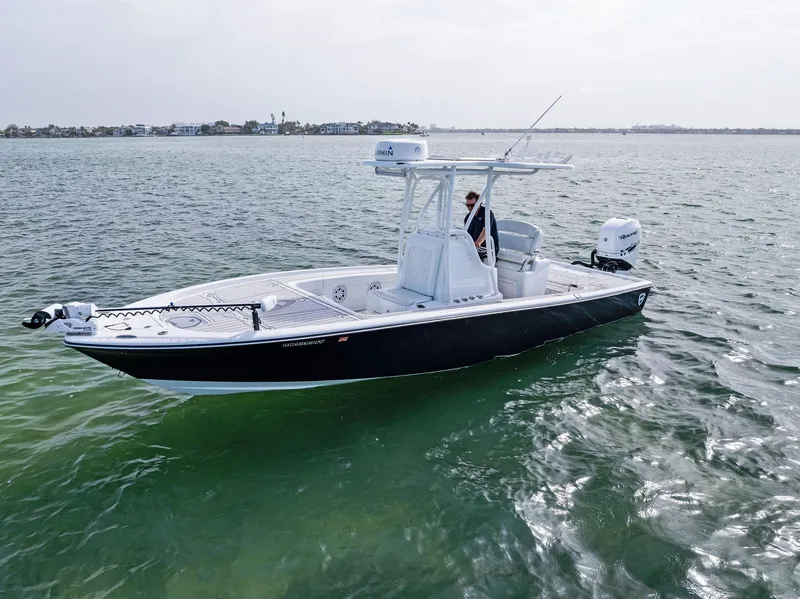 Slide: The Image of 2018 Barker Boatworks 26 Calibogue Bay on calm water, side view. - 8