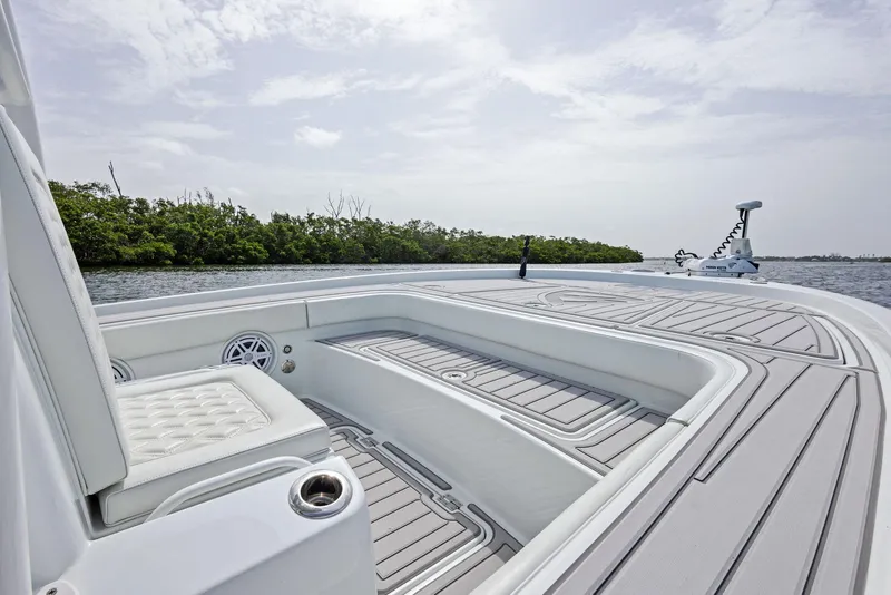 Slide: The Image of 2018 Barker Boatworks 26 Calibogue Bay deck with seating, on calm water. - 14