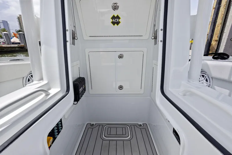 Slide: The Image of 2018 Barker Boatworks 26 Calibogue Bay interior with storage compartments and sleek design. - 22