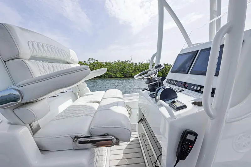 Slide: The Image of 2018 Barker Boatworks 26 Calibogue Bay interior with modern helm and seating. - 24
