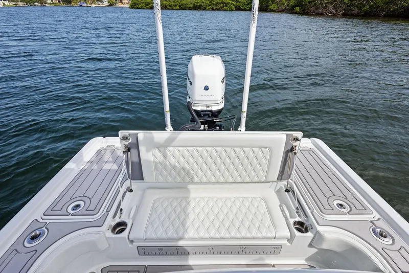 Slide: The Image of 2018 Barker Boatworks 26 Calibogue Bay, rear view with outboard motor on water. - 33