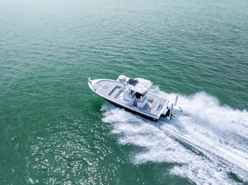 Slide: The Image of 2018 Barker Boatworks 26 Calibogue Bay cruising on open water. - 41