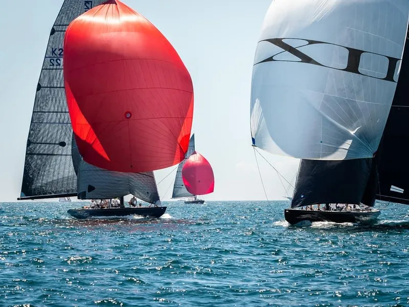 The Image of Sailboats with colorful spinnakers racing on open water, 1982 12 Meter model. - 0