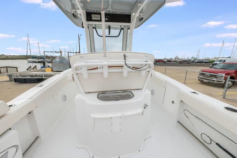 Slide: The Image of 2022 Sea Hunt Gamefish 27CE boat interior with spacious deck and modern design. - 11