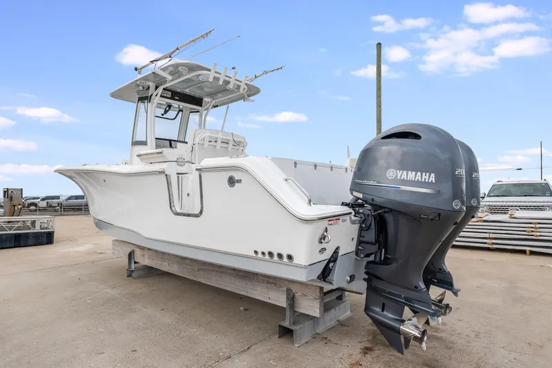 Slide: The Image of 2022 Sea Hunt Gamefish 27CE boat with Yamaha engine on display. - 5