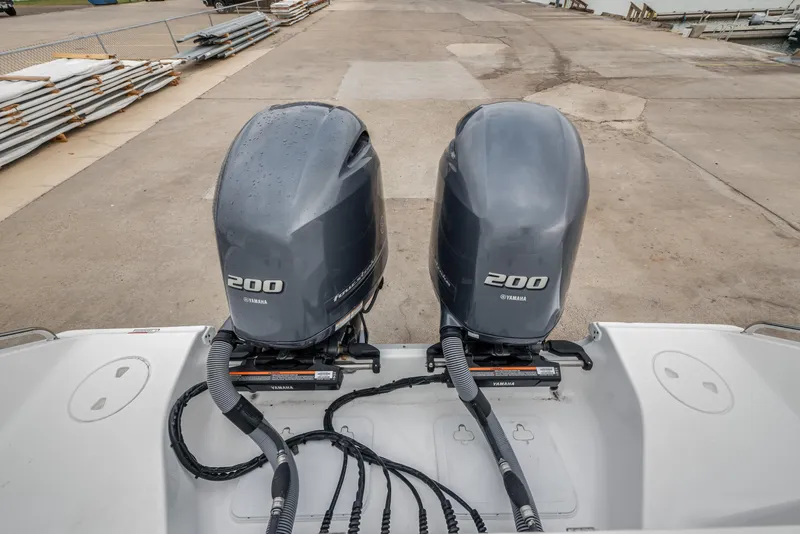 Slide: The Image of Twin Yamaha 200 engines on a 2022 Sea Hunt Gamefish 27CE boat. - 8
