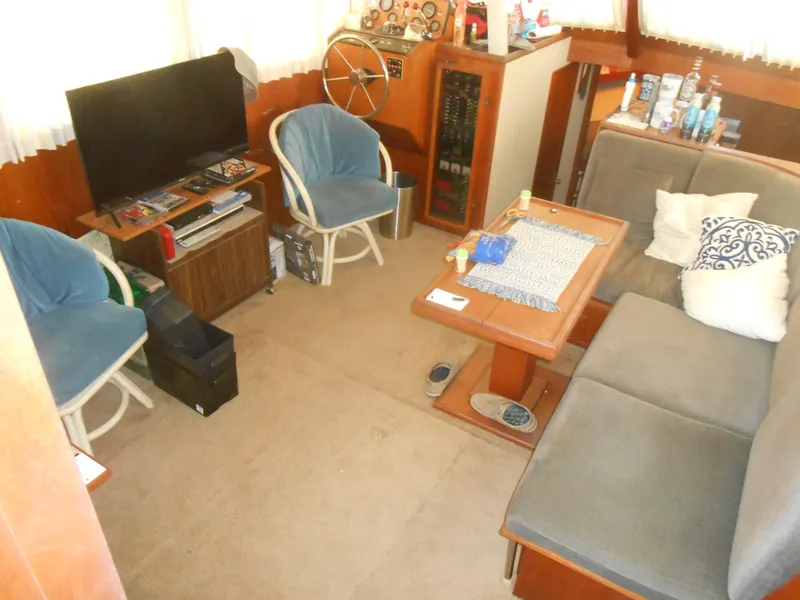 Slide: The Image of Interior of 1981 Uniflite Cabin Cruiser with seating, table, and steering wheel. - 5