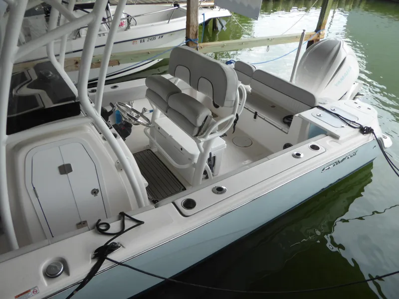 Slide: The Image of 2022 Sea Fox 248 Commander boat docked, featuring spacious seating and modern design. - 5