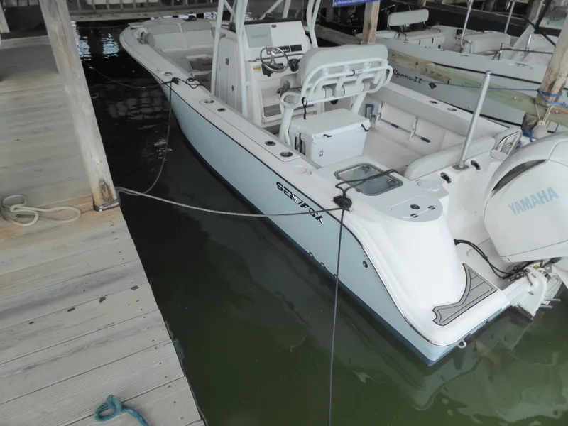 Slide: The Image of 2022 Sea Fox 248 Commander boat docked with Yamaha engine. - 7