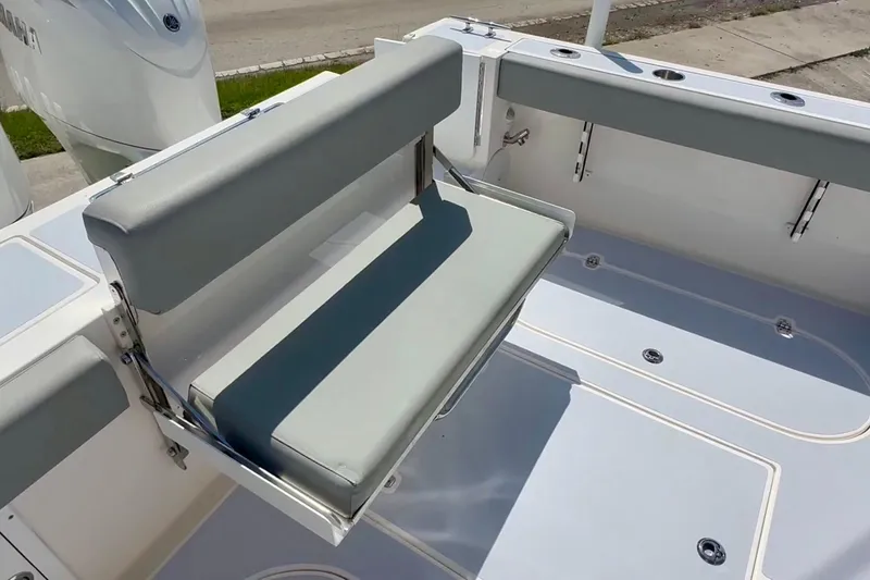 Slide: The Image of 2024 NorthCoast 255HT boat with foldable seating and spacious deck area. - 10