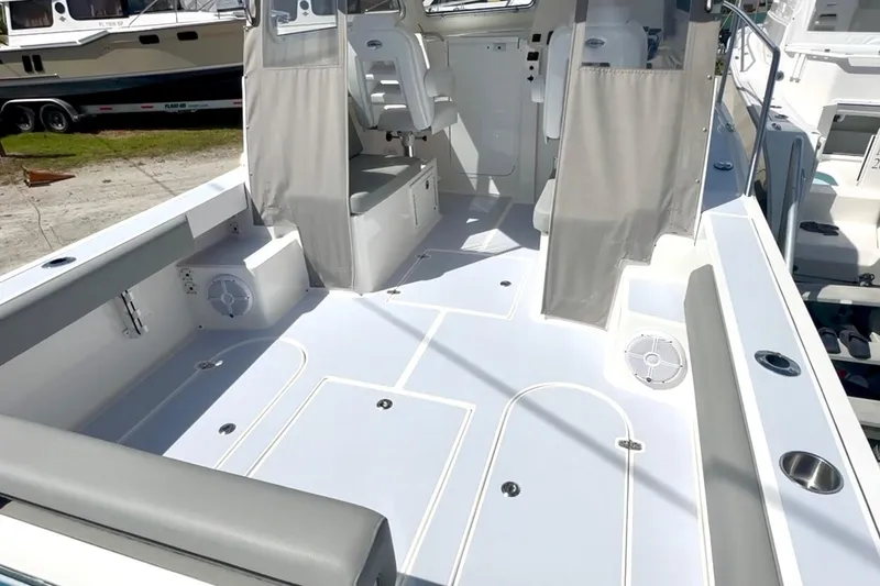 Slide: The Image of 2024 NorthCoast 255HT boat interior with seating and clean deck layout. - 13