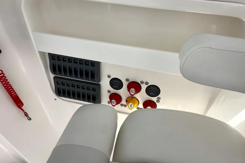 Slide: The Image of 2024 NorthCoast 255HT boat interior showing control panel and seating. - 22