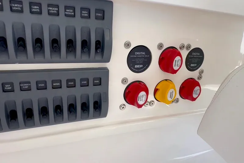 Slide: The Image of 2024 NorthCoast 255HT boat control panel with switches and digital relays. - 26