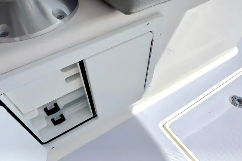 Slide: The Image of 2024 NorthCoast 255HT boat interior storage compartment and seating detail. - 35