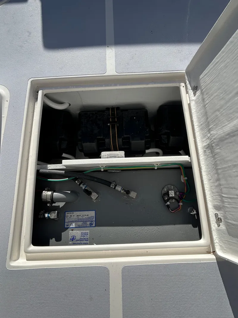 Slide: The Image of 2024 NorthCoast 255HT boat compartment with wiring and components visible. - 41