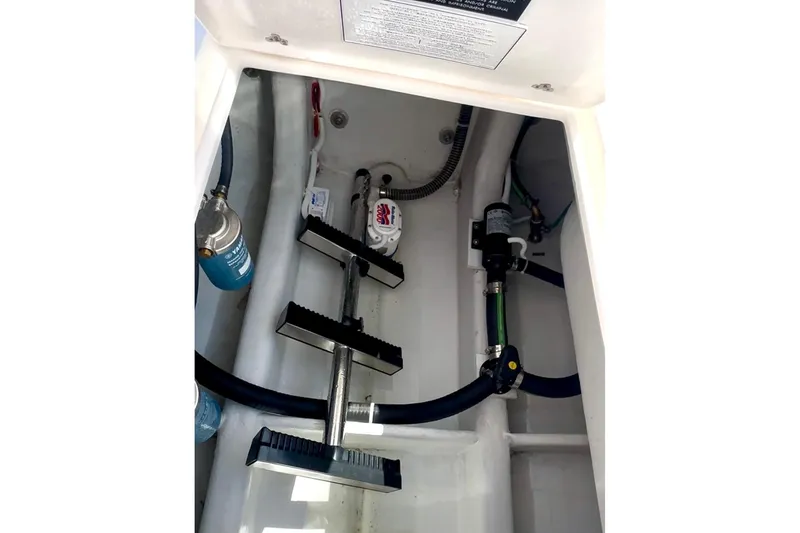 Slide: The Image of 2024 NorthCoast 255HT boat interior showing mechanical components and plumbing. - 45