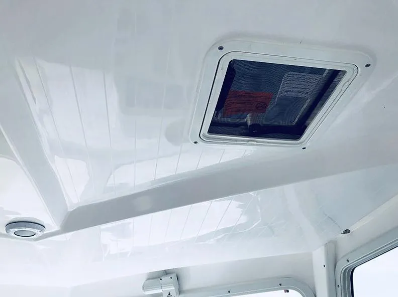 Slide: The Image of Interior ceiling of 2024 NorthCoast 285HT boat with hatch and light fixture. - 14