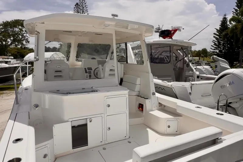 Slide: The Image of 2024 NorthCoast 285HT boat with spacious deck and modern design. - 2