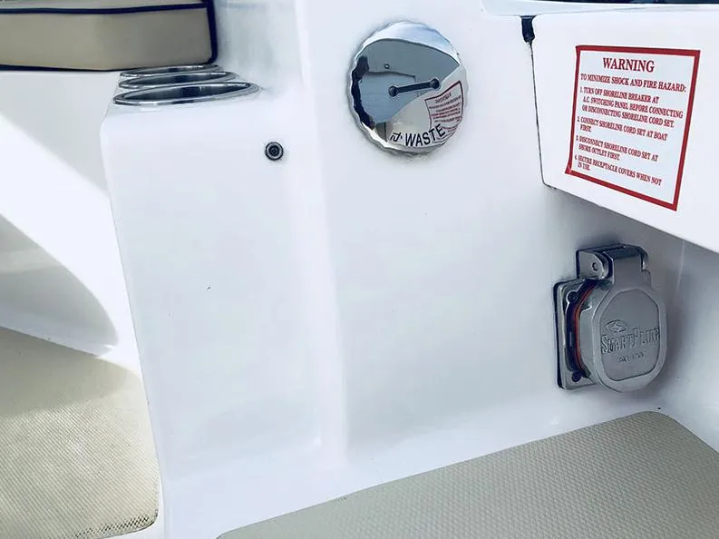 Slide: The Image of 2024 NorthCoast 285HT boat waste disposal and warning label detail. - 21