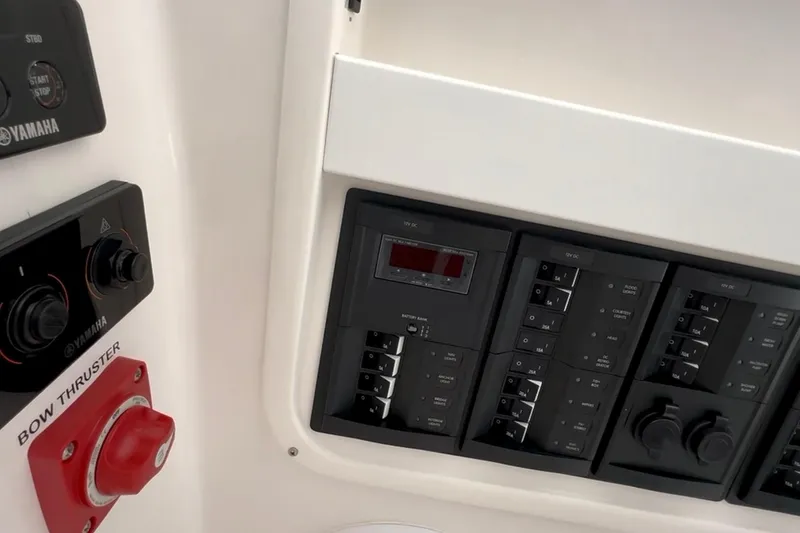Slide: The Image of Control panel of 2024 NorthCoast 285HT boat, featuring Yamaha controls and bow thruster. - 30