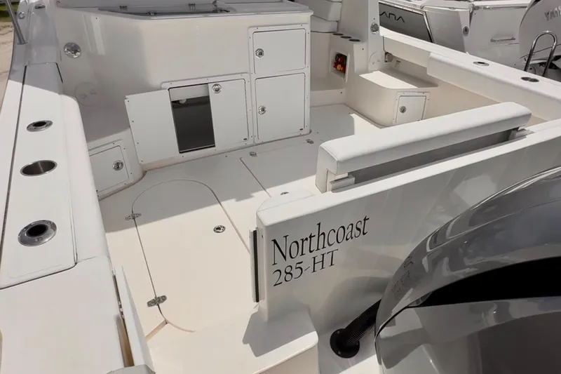 Slide: The Image of 2024 NorthCoast 285HT boat interior with seating and storage compartments. - 4