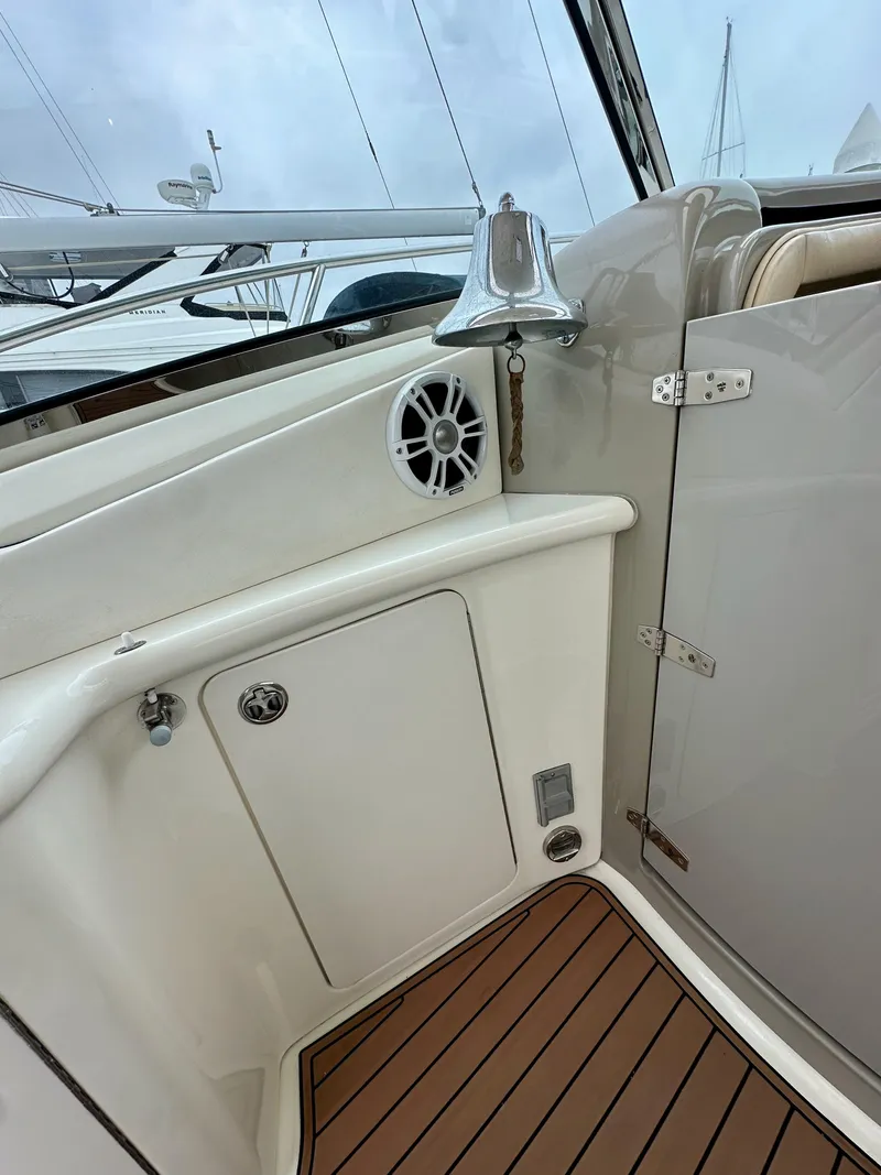 Slide: The Image of 2006 Sea Ray 44 Sundancer yacht interior with wood flooring and chrome bell. - 17
