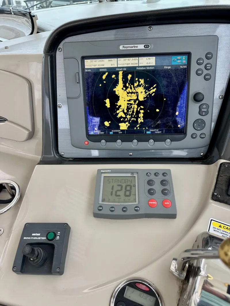 Slide: The Image of Control panel of a 2006 Sea Ray 44 Sundancer with navigation display. - 25