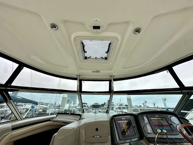 Slide: The Image of Interior view of 2006 Sea Ray 44 Sundancer yacht cockpit with navigation controls. - 27