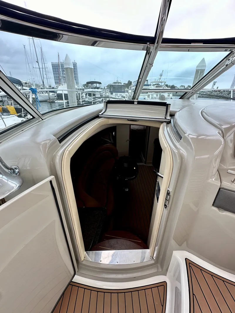 Slide: The Image of 2006 Sea Ray 44 Sundancer yacht interior entrance with marina view. - 28