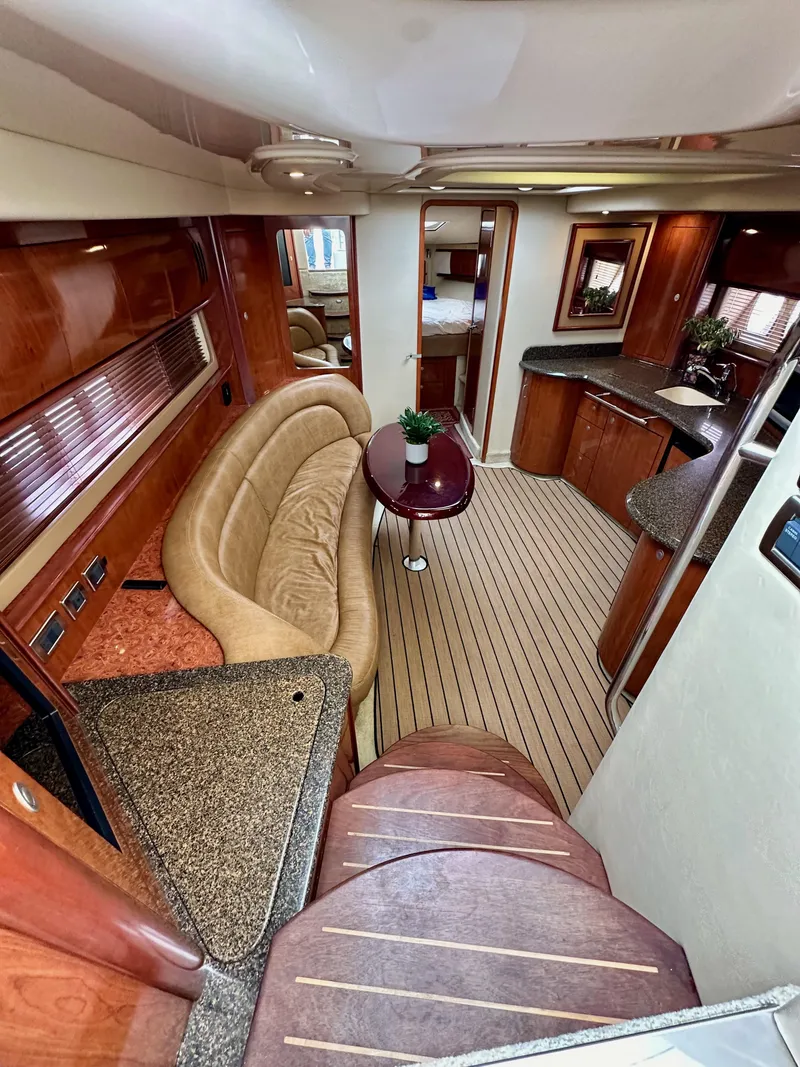 Slide: The Image of Luxurious interior of 2006 Sea Ray 44 Sundancer yacht with elegant seating and modern kitchen. - 30