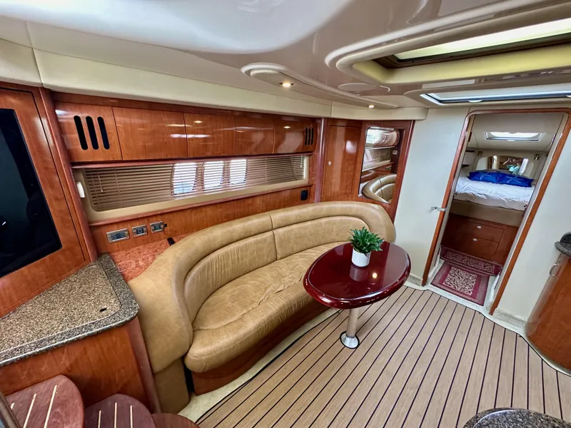 Slide: The Image of Luxurious interior of 2006 Sea Ray 44 Sundancer yacht with elegant seating and wood finishes. - 34