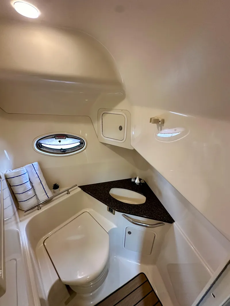 Slide: The Image of 2006 Sea Ray 44 Sundancer bathroom with modern fixtures and compact design. - 41