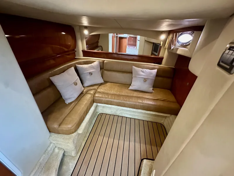 Slide: The Image of Interior of 2006 Sea Ray 44 Sundancer with leather seating and wooden accents. - 42
