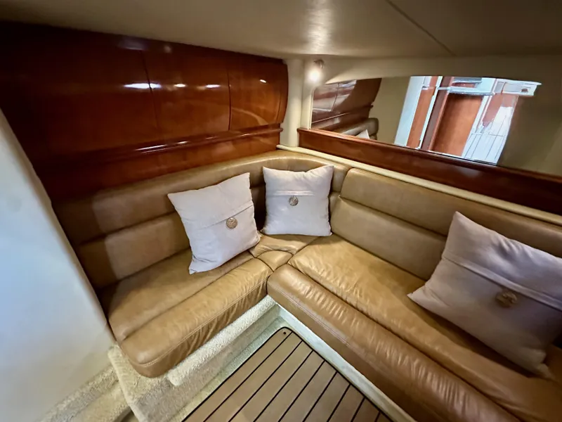 Slide: The Image of Luxurious interior of 2006 Sea Ray 44 Sundancer with leather seating and decorative pillows. - 44