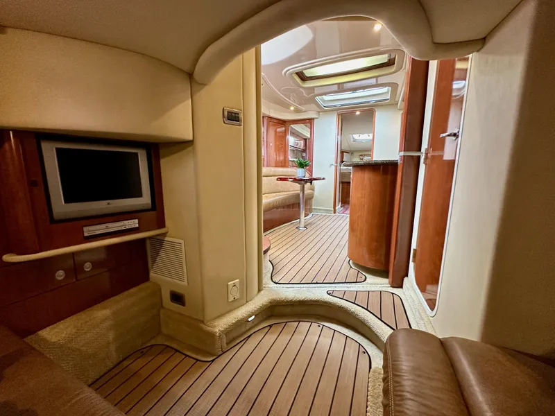 Slide: The Image of Interior of 2006 Sea Ray 44 Sundancer yacht, featuring elegant wood finishes and modern amenities. - 46