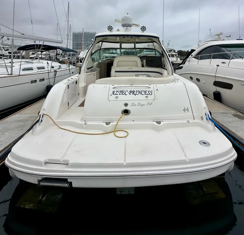 Slide: The Image of 2006 Sea Ray 44 Sundancer yacht docked, rear view, named "Aztec Princess." - 5