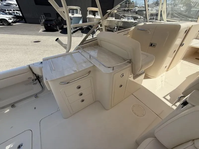 Slide: The Image of 2025 Grady-White Freedom 285 boat interior with seating and storage compartments. - 13
