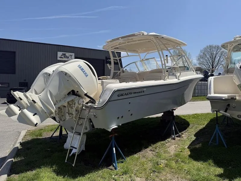 Slide: The Image of 2025 Grady-White Freedom 285 boat with Yamaha engines on display outdoors. - 2